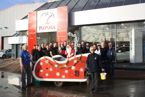 Benfield Toyota Motors staff and the Rothwell Lions Santa Sleigh